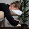 Massage table arm loop on the headrest