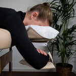 Massage table arm loop on the headrest